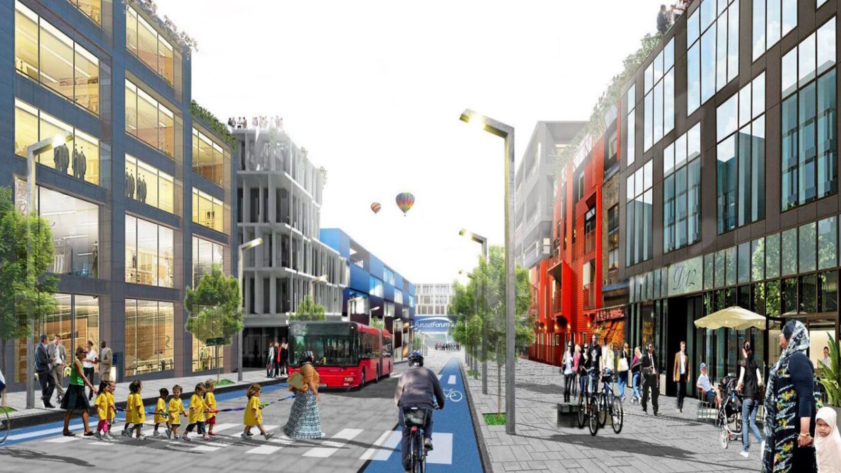 Halvor Voldstad i Bydel Alna viser frem utstillingen på Furuset senter.